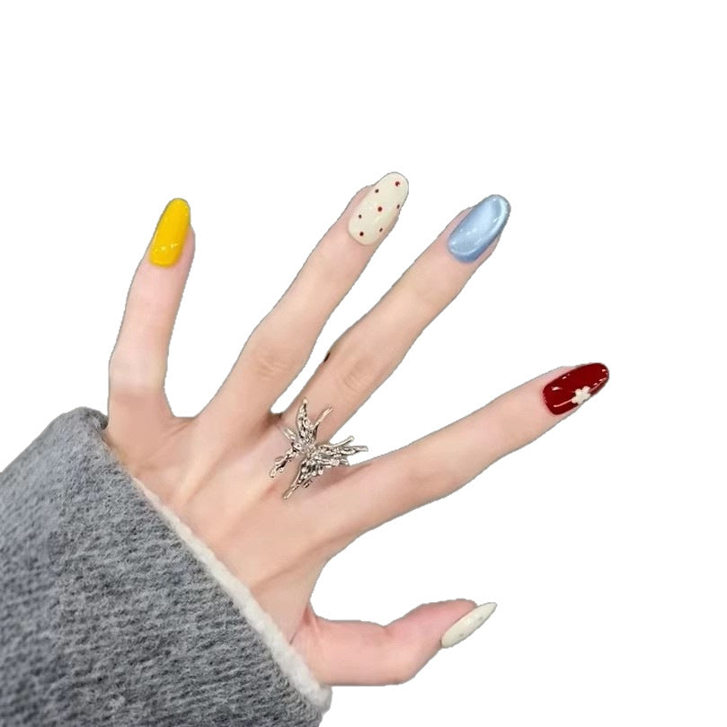 Baby blue polka dot French-style press-on nails with a blusher effect, creating a cute and sweet Instagram-worthy look