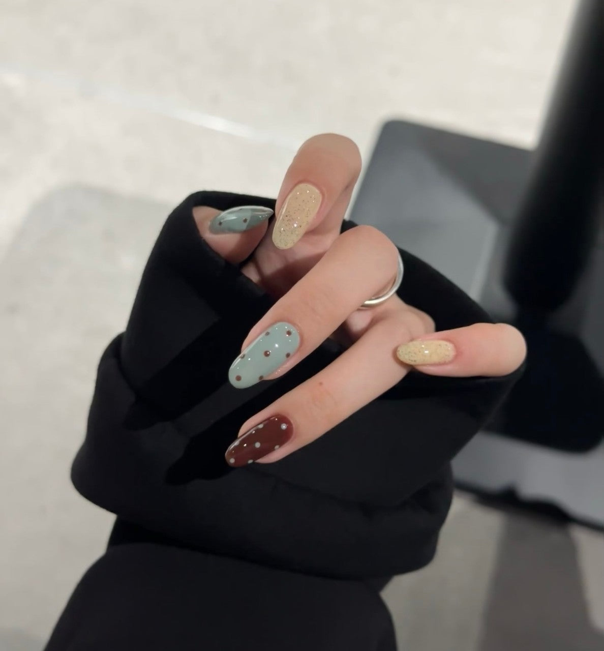 Baby blue polka dot French-style press-on nails with a blusher effect, creating a cute and sweet Instagram-worthy look